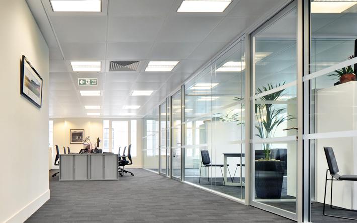 Glass partitions are becoming increasingly popular in offices